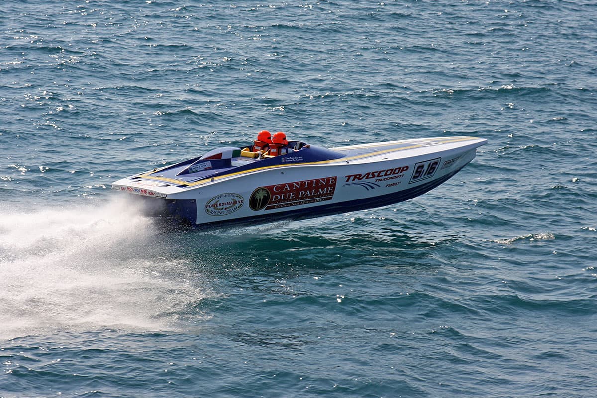 White and blue Power 27 Racing in a race