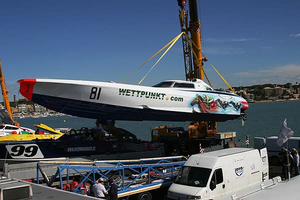 Power 43 Racing no. 81 lifted by crane in harbour