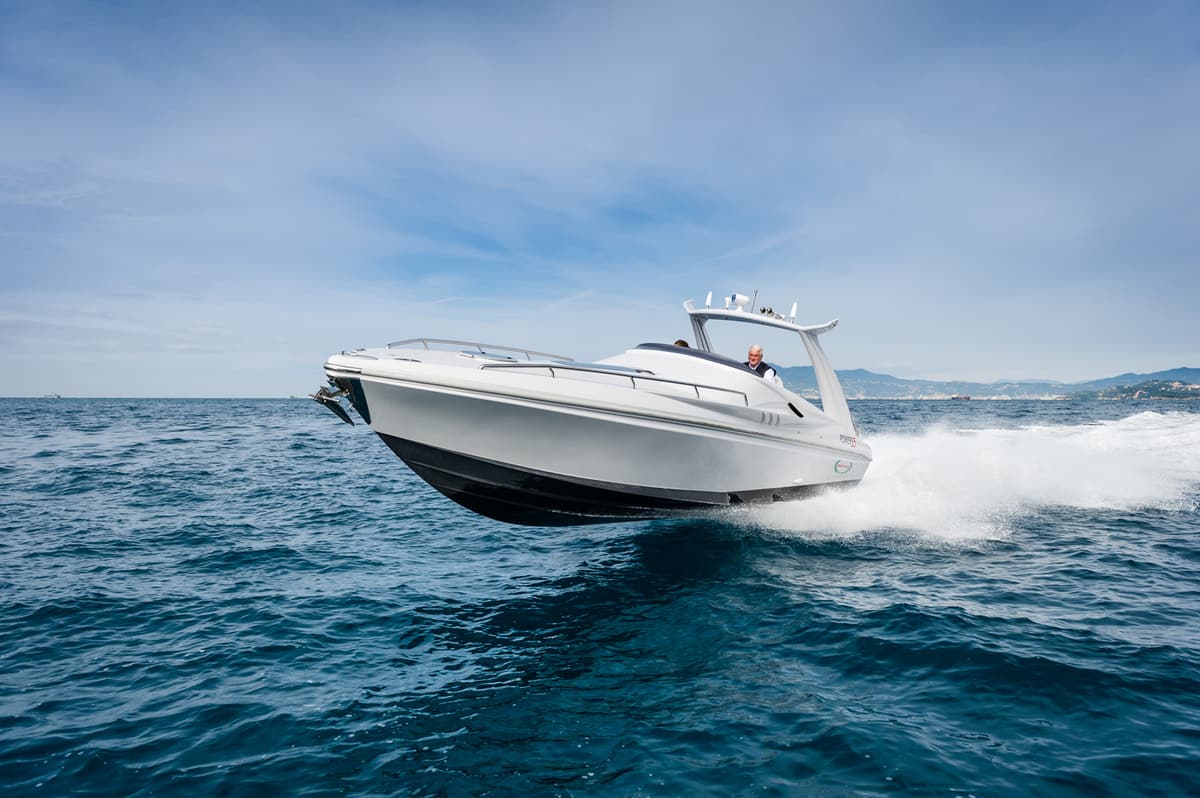 White Power 35 planing on open sea, three-quarter bow view