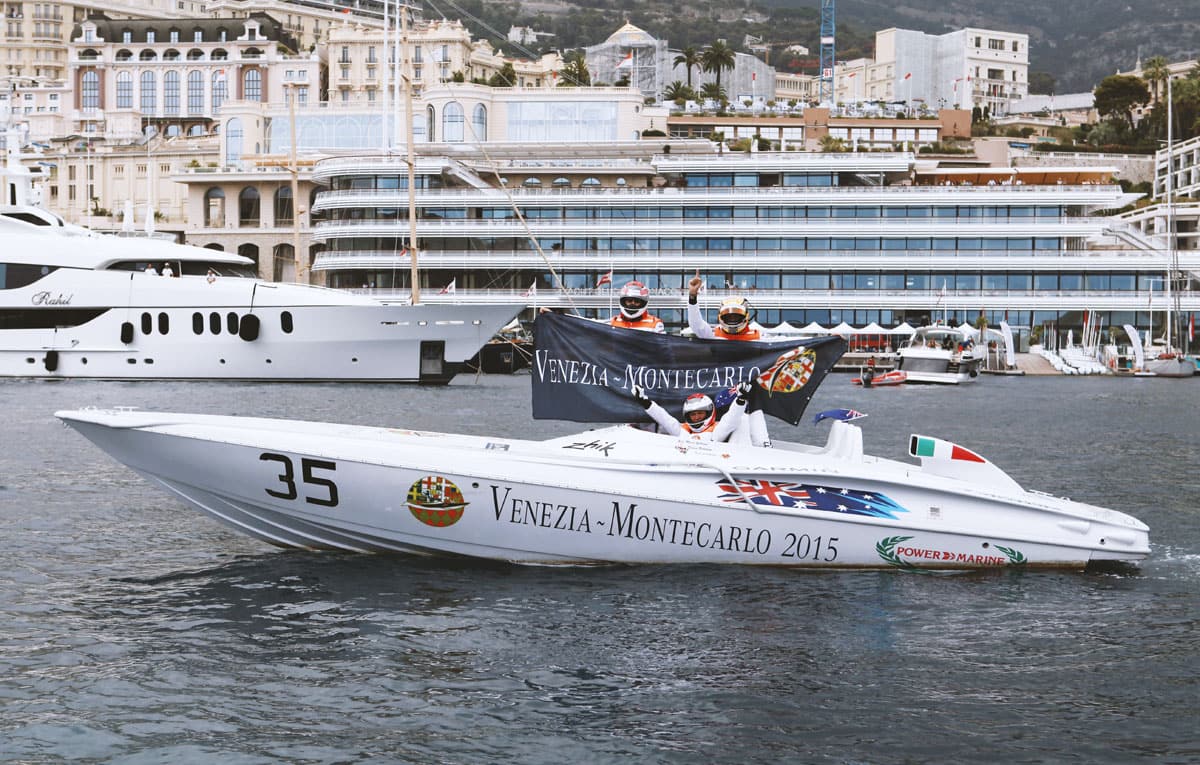 Power 27 R no. 35 moored in Monaco harbour with the crew